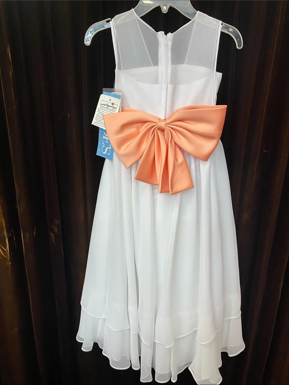 White Girls' Sleeveless Dress with Coral Sash and Floral Accent